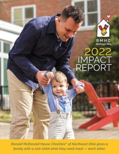 Cover of the RMHC NEO 2022 Impact Report. A dad helps his toddler son walk on the House patio