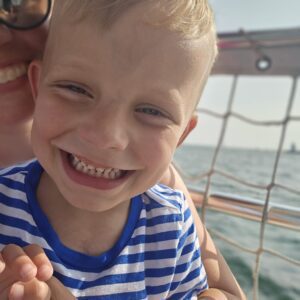 Tyler smiling at the beach