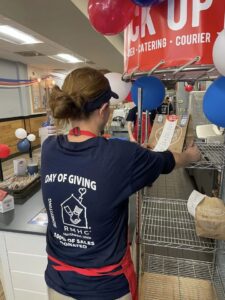 Jersey Mike's store employee with day of giving shirt
