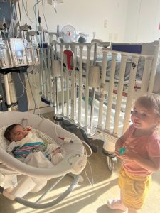 baby in PICU with sister