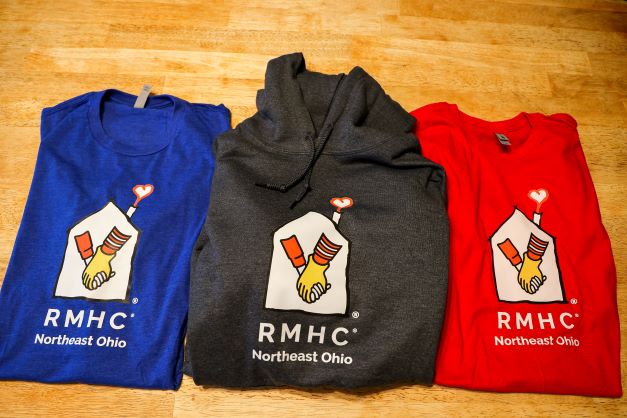 three shirts with RMHC NEO logo