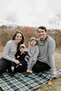 Mom, Dad and two baby girls in family photo