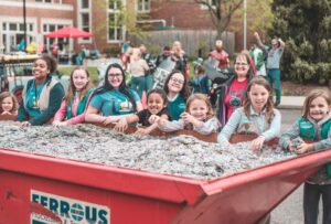 girl scout troop with full recycling bin of pull tabs