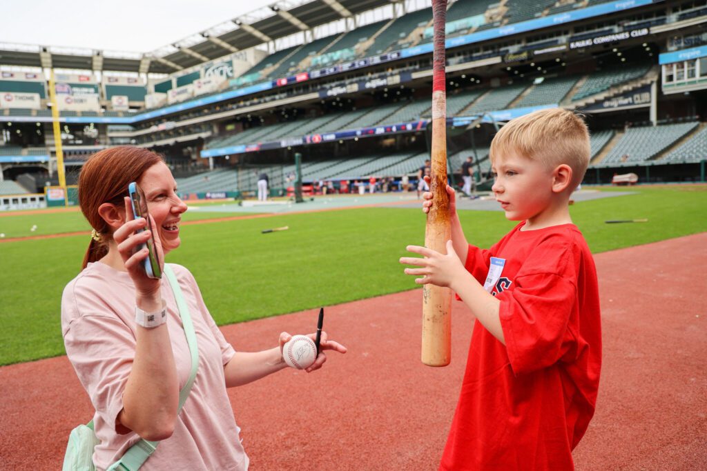 Mom and brother Facetime with boy in hospital from baseball field