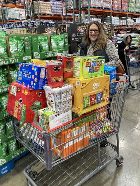 woman with cart FULL of snack 