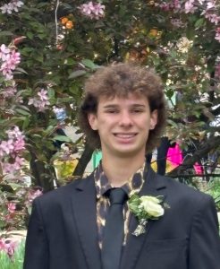 young man wearing suit smiling for camera