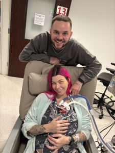 woman and man holding infant son