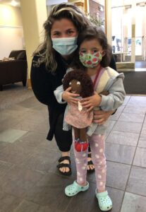 Mom and daughter with doll