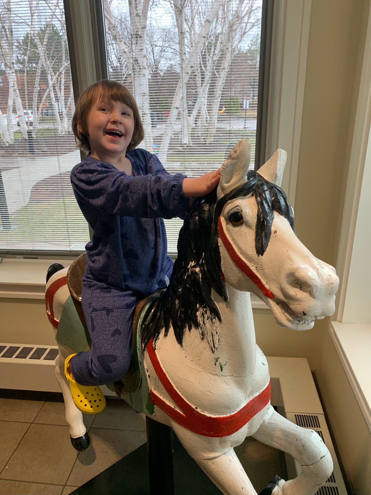 Isla Vagi playing in the sunroom