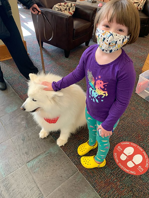 Isla Vagi with Sochi the therapy dog