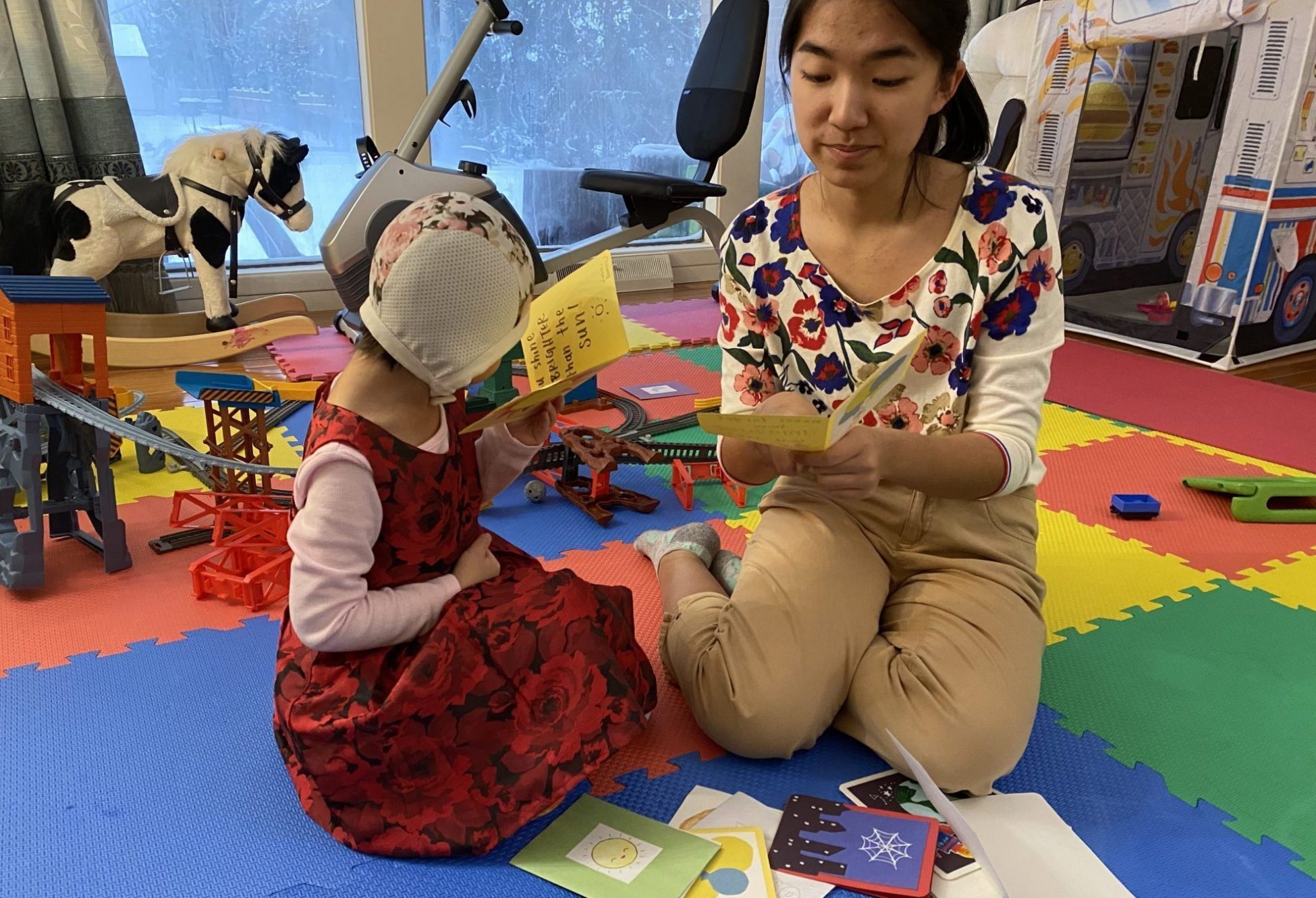 Bowen reads cards with sister Kloe