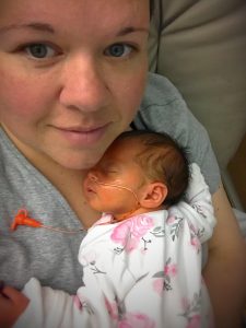 Julie holding newborn Logan