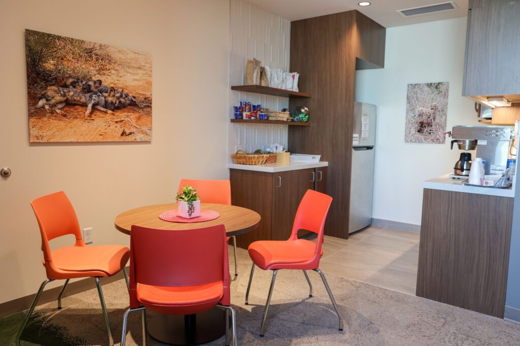 The Dining Area for Family Room at Metro Health is a Homey modern space with s kitchenette, table and chairs.