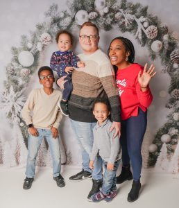 family photo of mom, dad, and three little boys