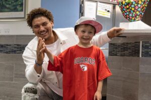 man giving high-five to child