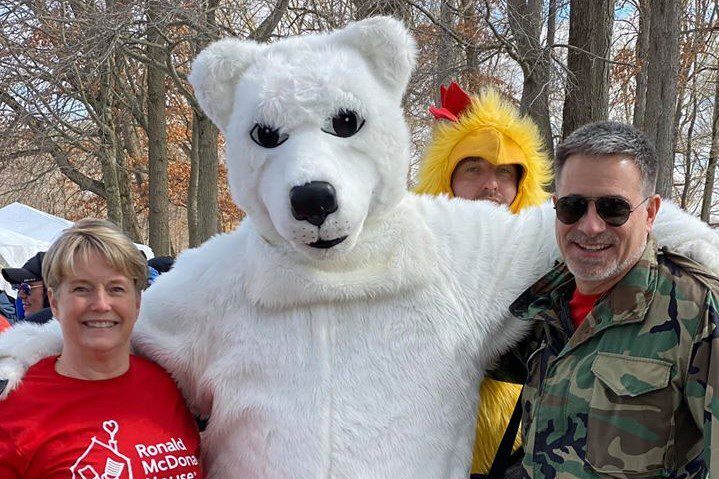 Couple standing with Polar Bear and Chilly Chicken at 2020 Jump