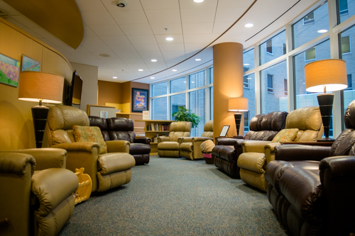 The Rainbow Babies Family Room At the Hospital is a warm and comforting room. There are many comfortably padded chairs to relax in.