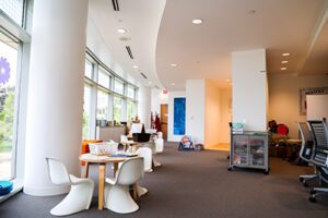 The STAR Center interior, with a bright wall of windows and children's seating and activities