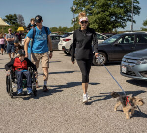 Walkers and wheelchair participants in walk