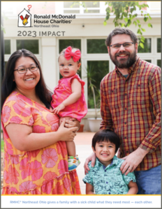 Family of four smiling, cover of the 2023 Impact Report