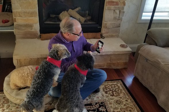 Glen Stout using facetime with his two dogs