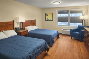 Guest room at RMHC NEO Akron, 2 double beds, armchair and dresser