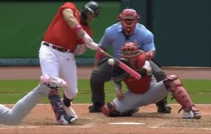 baseball player at the plate ready to hit ball