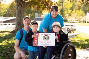 father, mother and two children, one in wheelchair