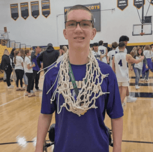 boy with basketball netaround neck